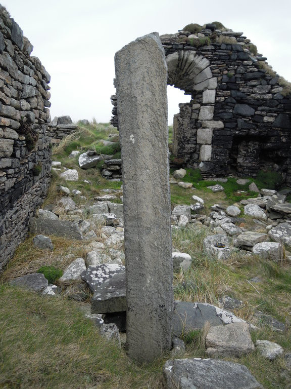 Cross Abbey Ogham stone incorporated into a grave structure, Belmullet peninsula, Co. Mayo