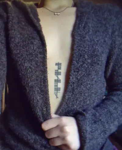 Ogham tattoo —  on chest